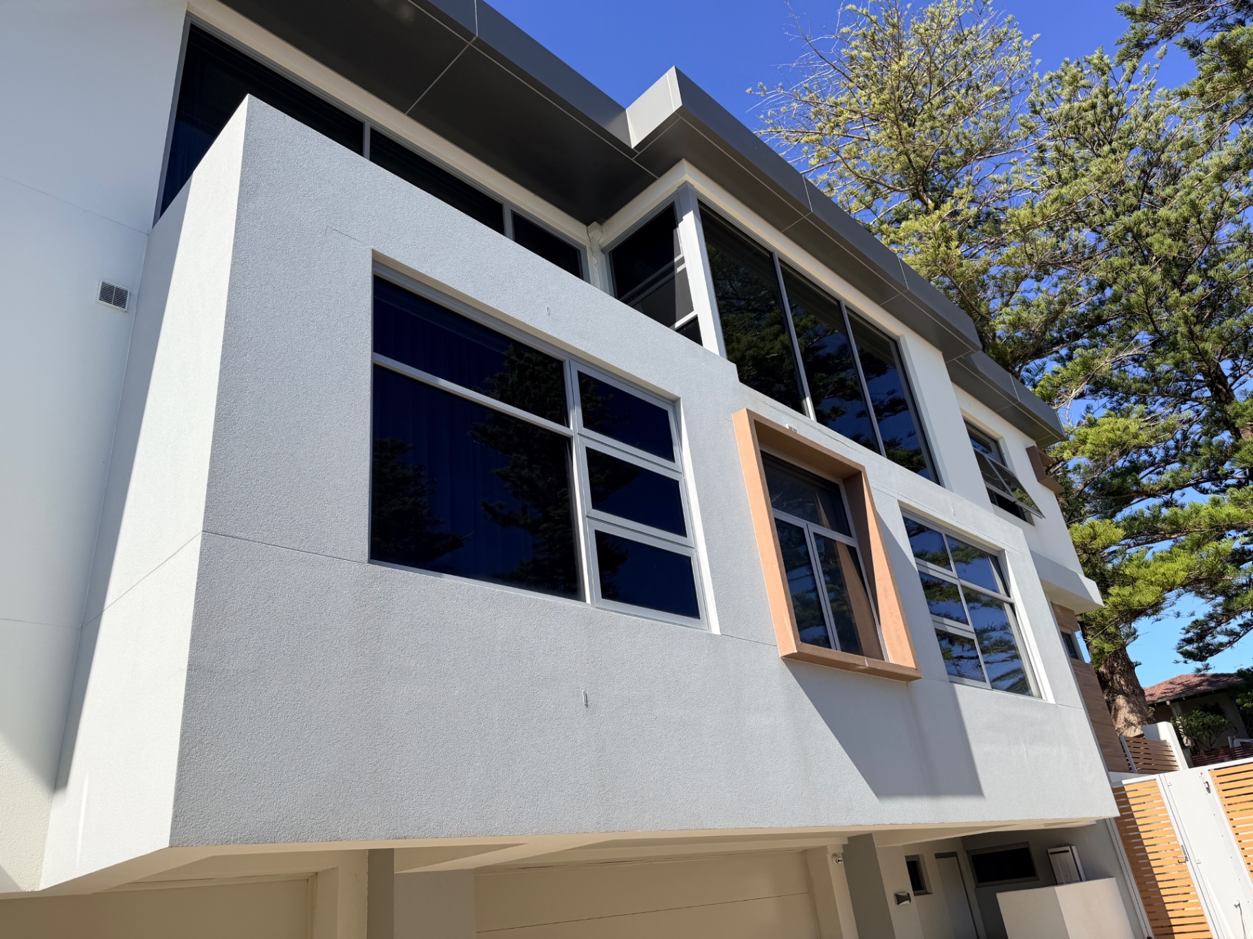 Finished North Beach render facade in full sun after AcraShield coating